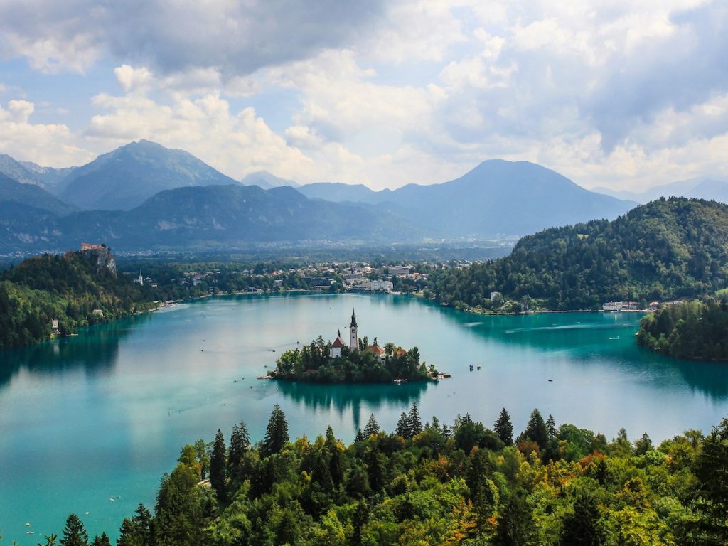 lake bled, slovenia with mountains in distance