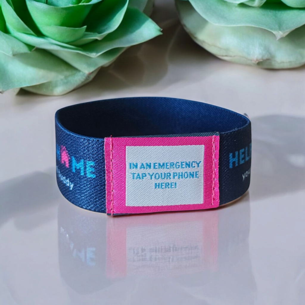 image showing wristband with text saying 'in an emergency tap your phone here'
